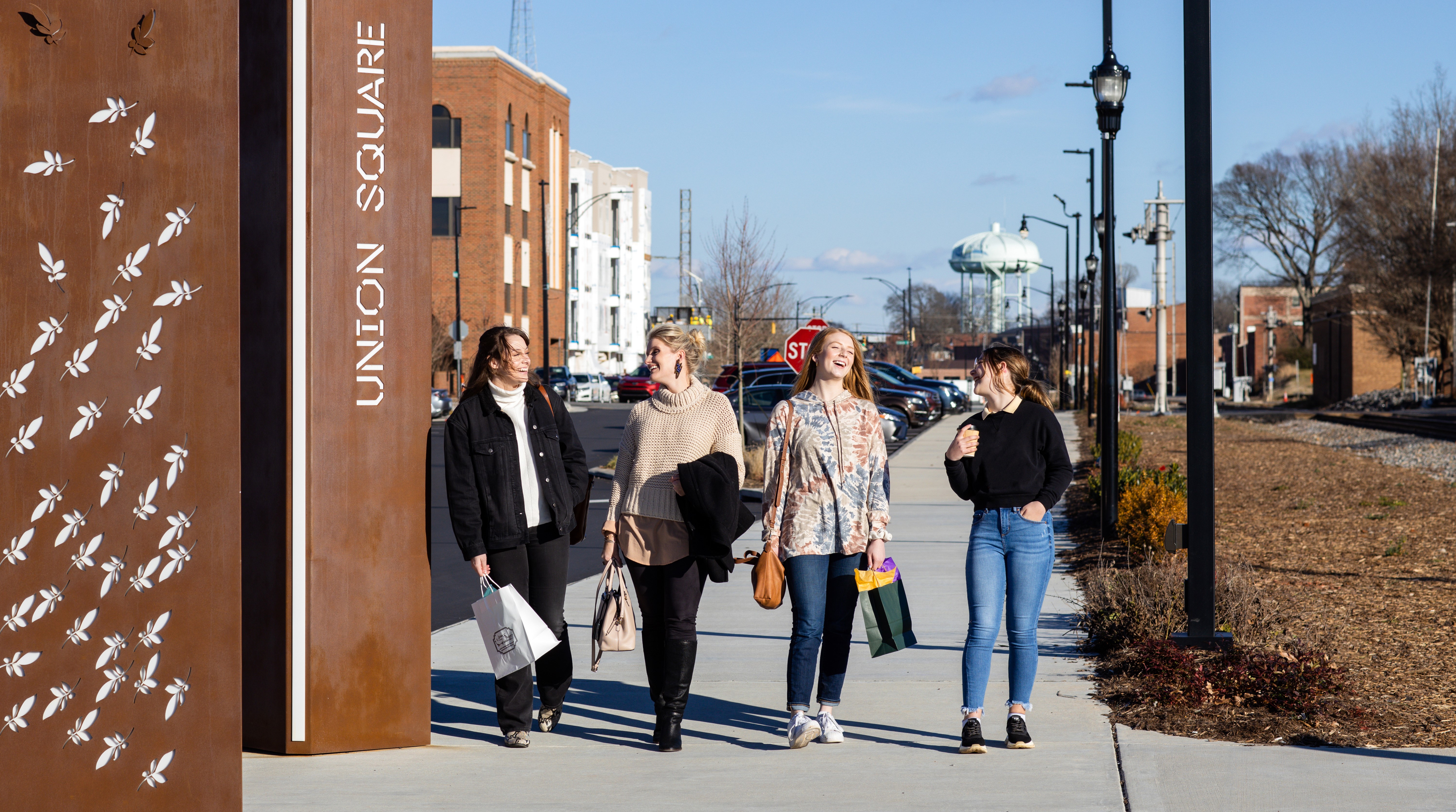 Four women walk on the City Walk near Union Square