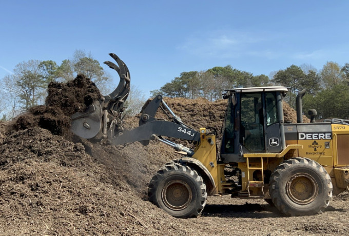 front loader truck picking up mulch