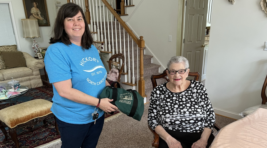 library staff delivers materials to senior resident