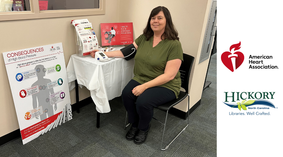 Senior Outreach Coordinator Jennifer Williams checks her blood pressure at Hickory Public Library