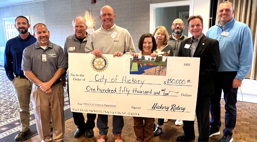 Rotary presents mock check to City staff and council members