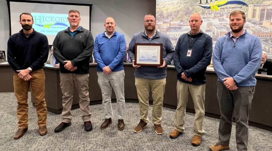 Public Utilities staff stand with the water quality award