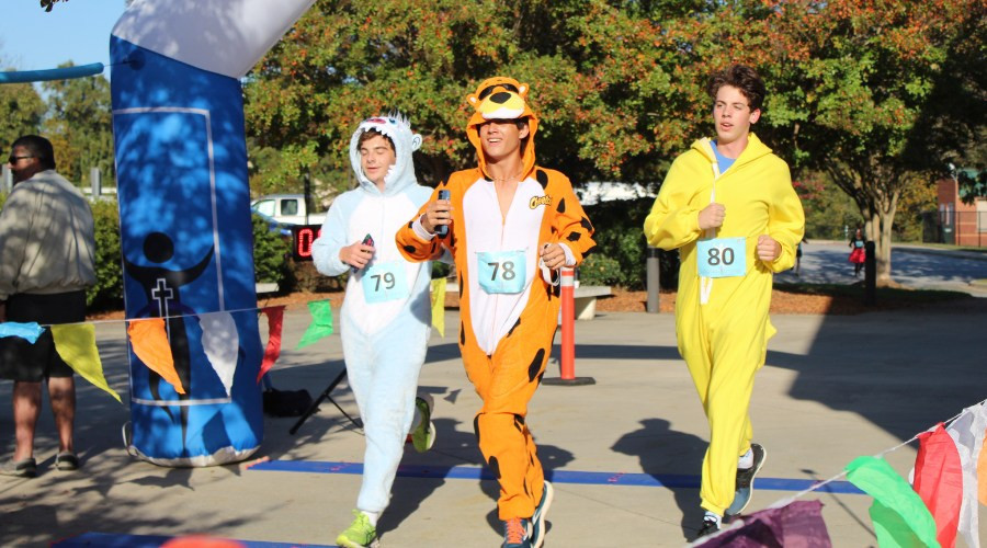 Trick or Trot 5K racers run in their Halloween costumes