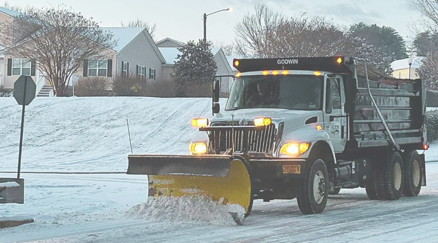 City crews plow the roads after snow