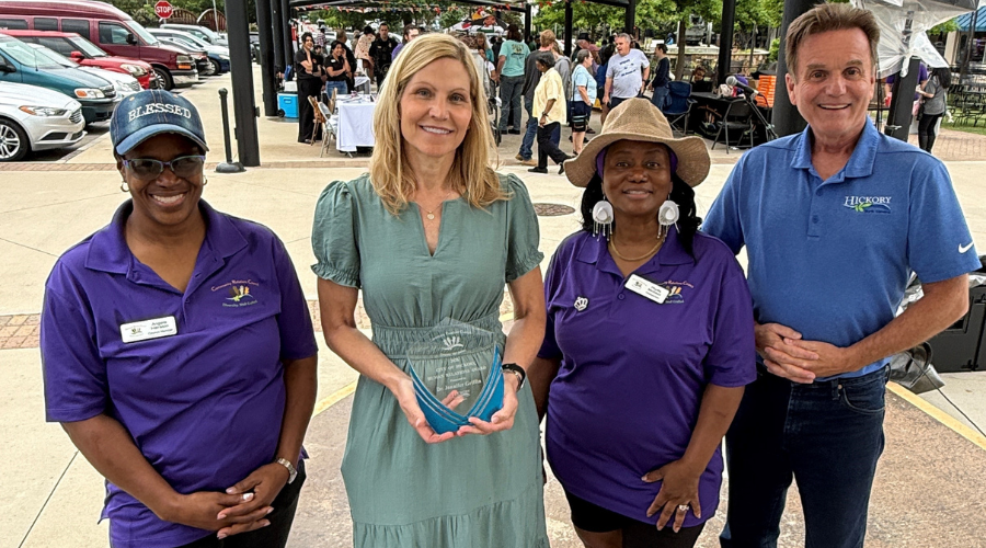 Dr. Jennifer Griffin poses with her Human Relations Award alongside CRC members and Hickory mayor