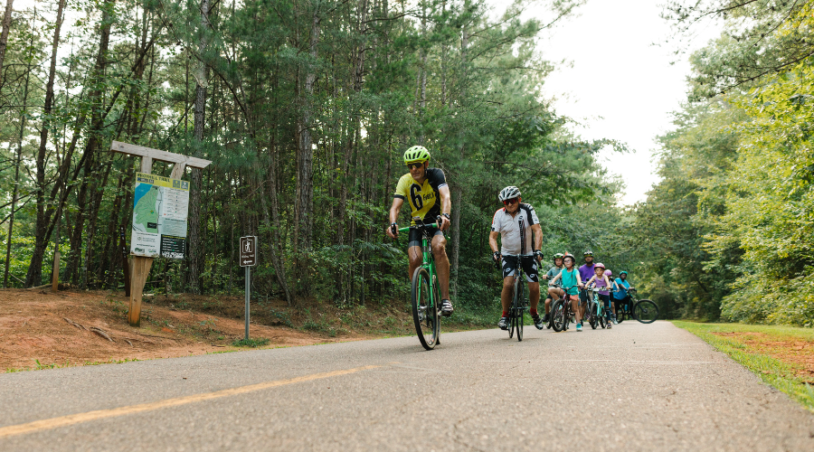 bicyclists riding on the paved greenway