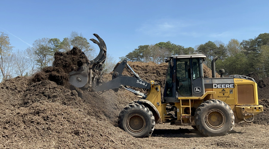 front loader truck picking up mulch
